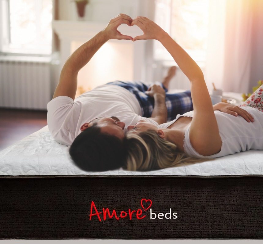 Couple Making A Heart On Amore Mattress